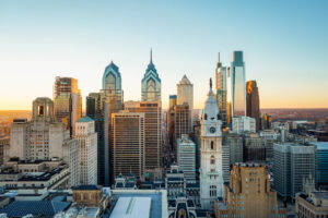 Sky is a light blue, the Philadelphia skyline is shown