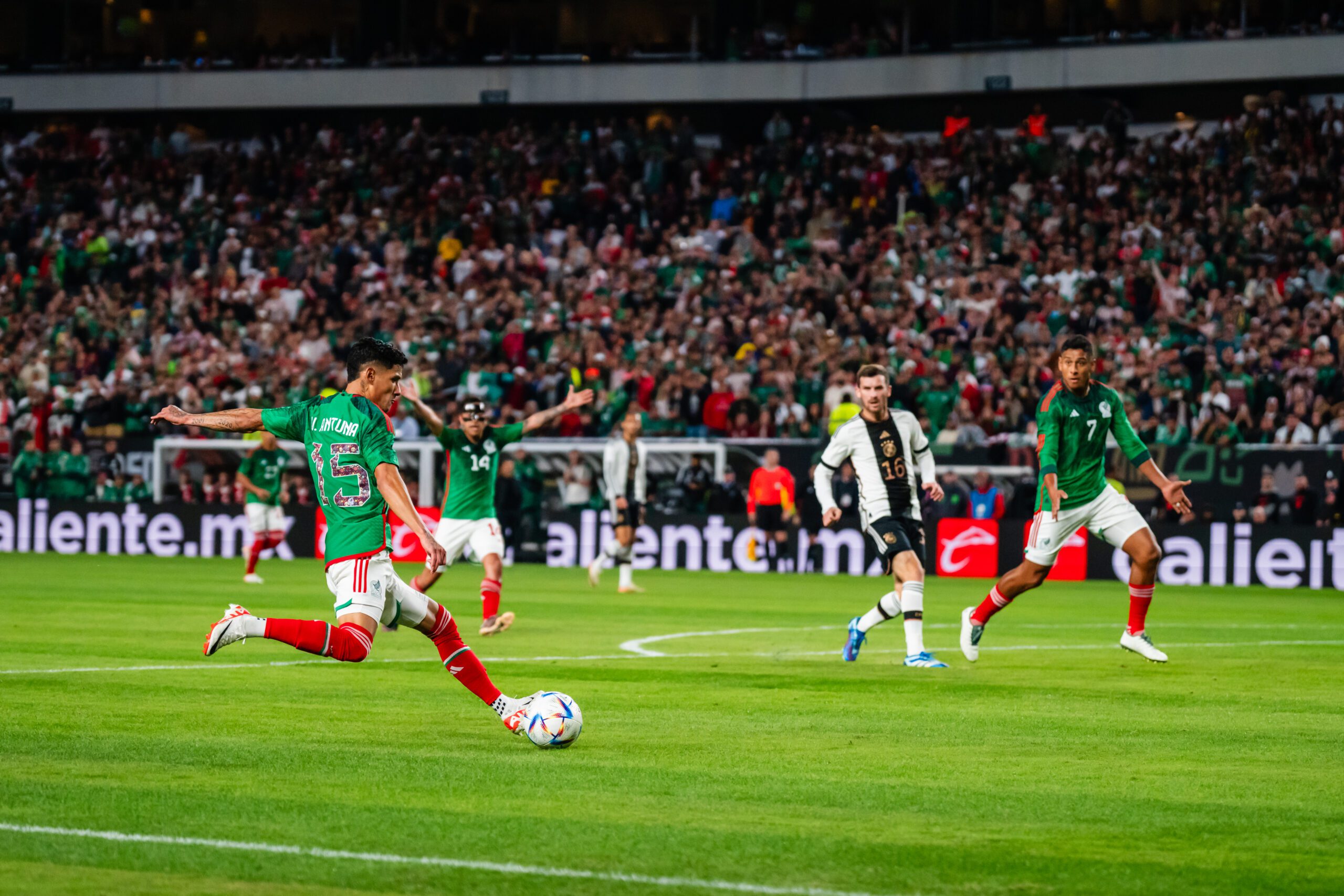 A soccer player form the Mexican national team kicking the ball during the 2023 MexTour exhibtion match against the German national team at Lincoln Financial Field.