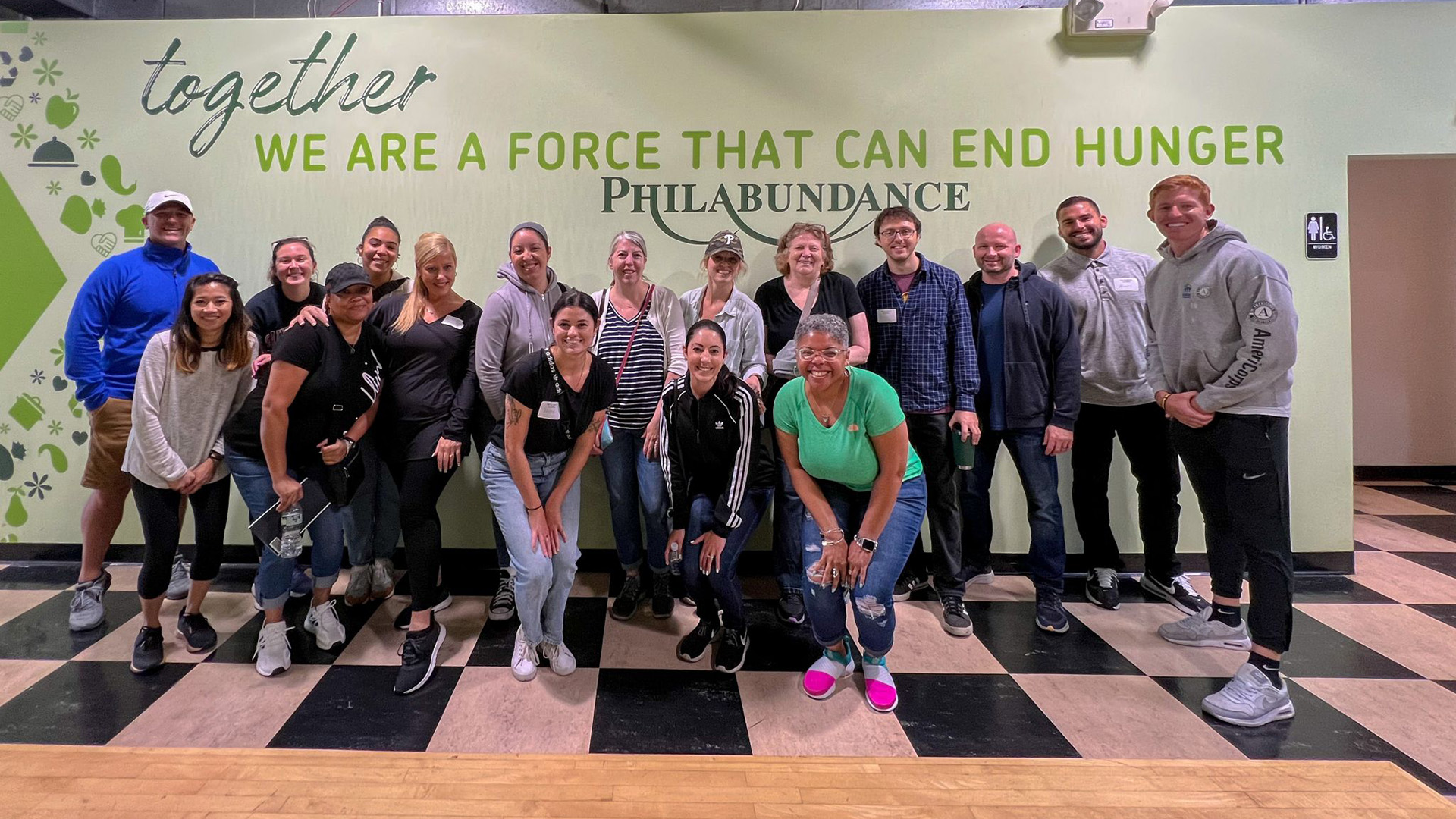 The PHLCVB and other members of the Philadelphia outside of the Philabundance floor after volunteering.