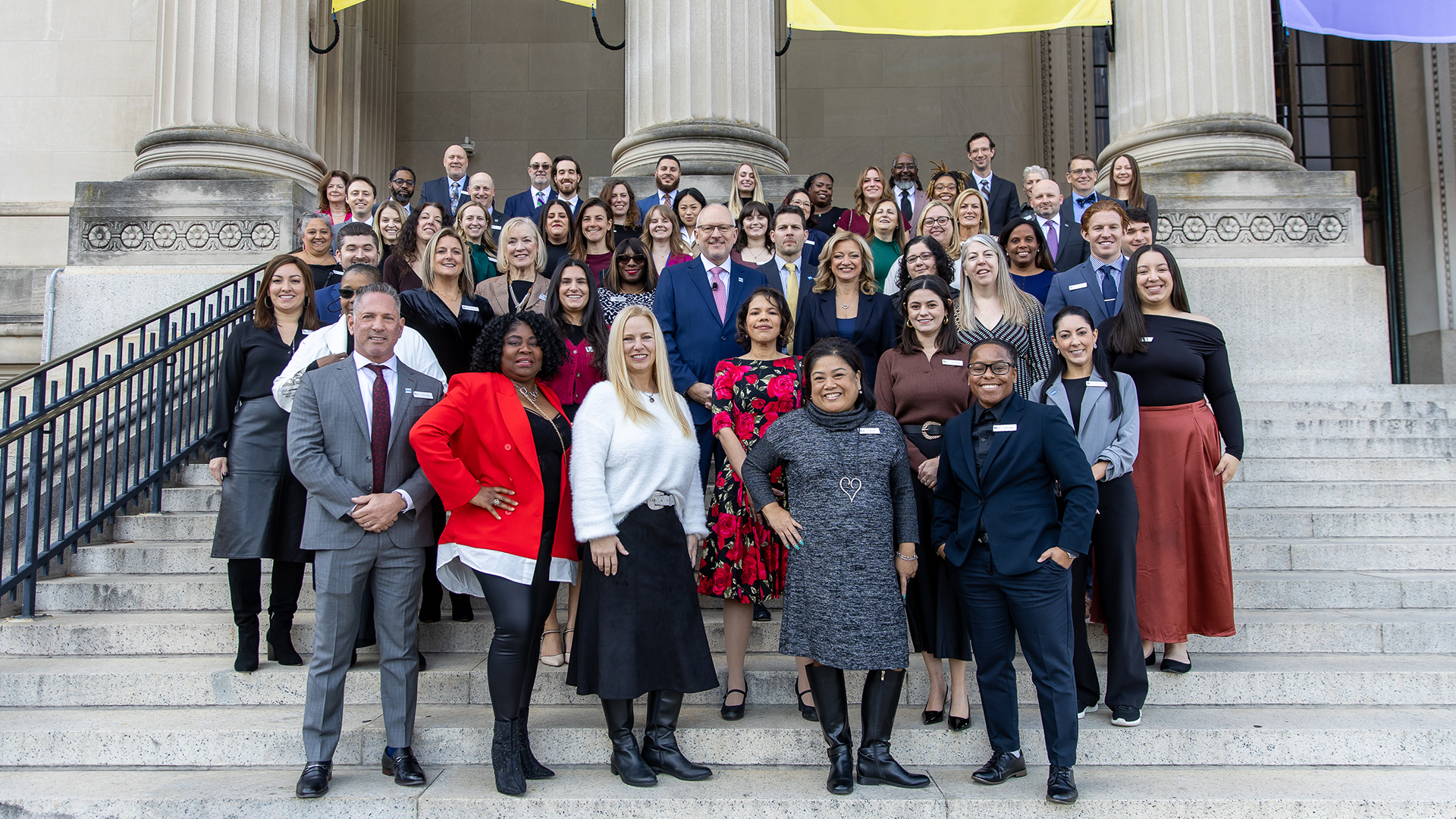 The PHLCVB staff stand on the steps of the Franklin Institute.