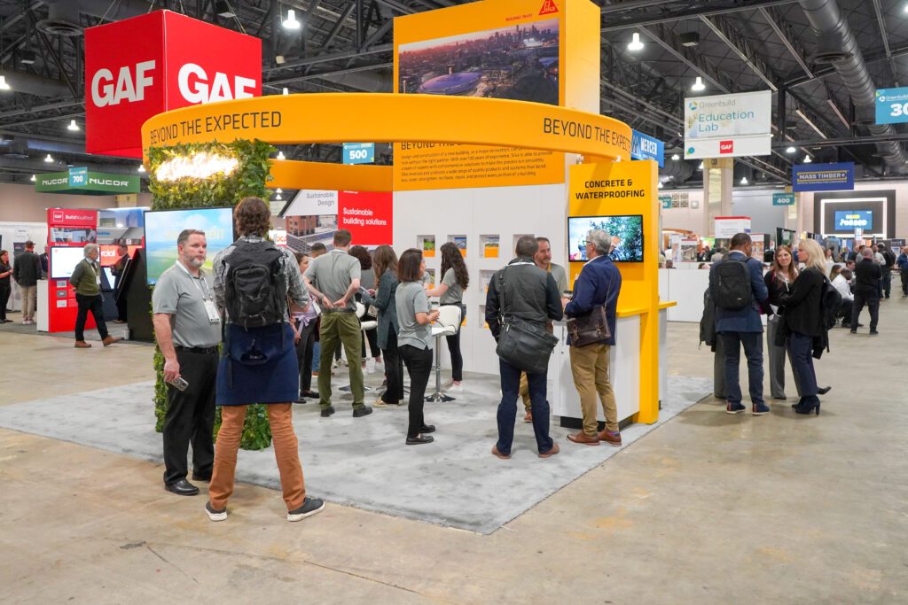 A group of attendees on the exhibit floor at Greenbuold 2024